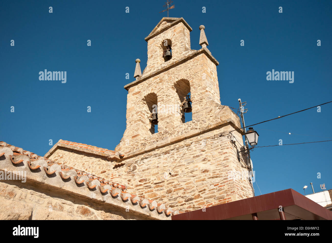 Wall with 3 bells on the church Stock Photo