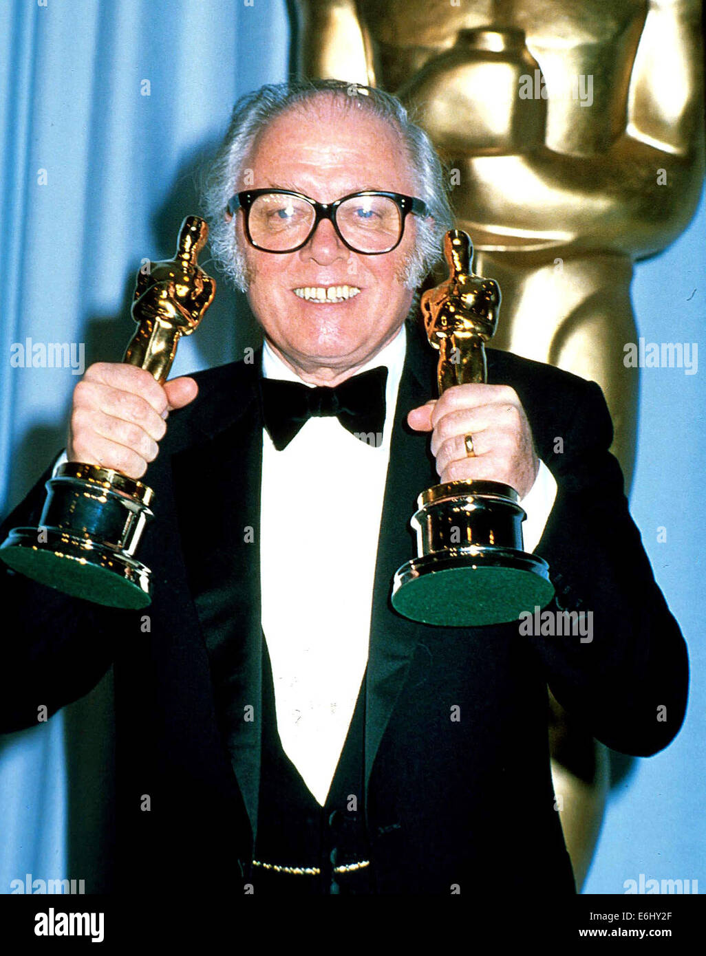RICHARD ATTENBOROUGH (Aug. 29, 1923 - Aug. 24, 2014) was an English actor, film director, producer and entrepreneur. He was the President of the Royal Academy of Dramatic Art (RADA). He won two Academy Awards as a film director and producer for 'Gandhi' in 1983. He has also won four BAFTA Awards and four Golden Globe Awards. PICTURED: Apr 11, 1983 - Hollywood, California, U.S. - Sir RICHARD ATTENBOROUGH with the two Oscars he won for his film 'Gandhi' in the Press Room during the 55th Academy Awards. © Laszlo Veres/Globe Photos/ZUMAPRESS.com/Alamy Live News Stock Photo