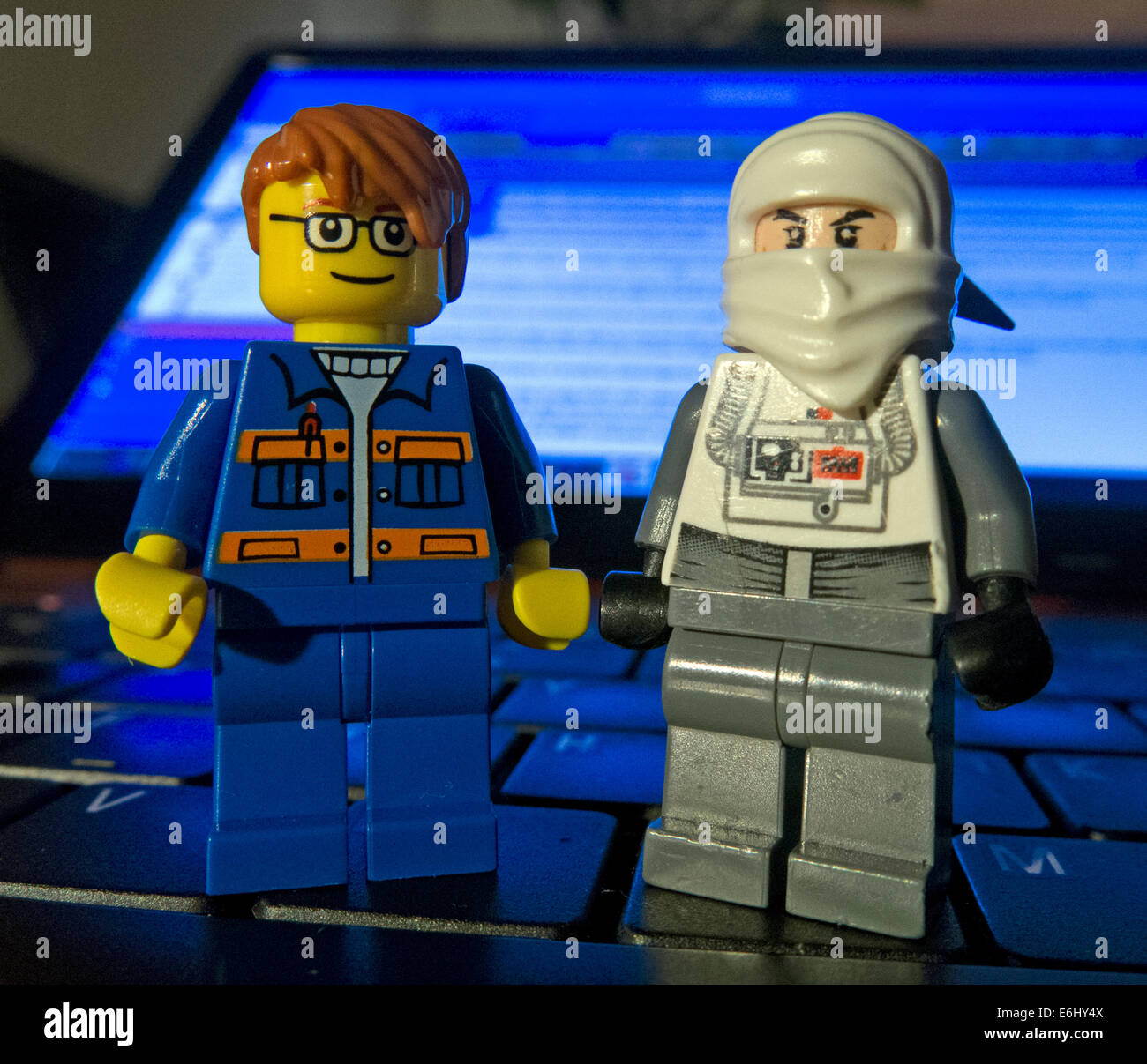 Two Lego men on a laptop keyboard Stock Photo