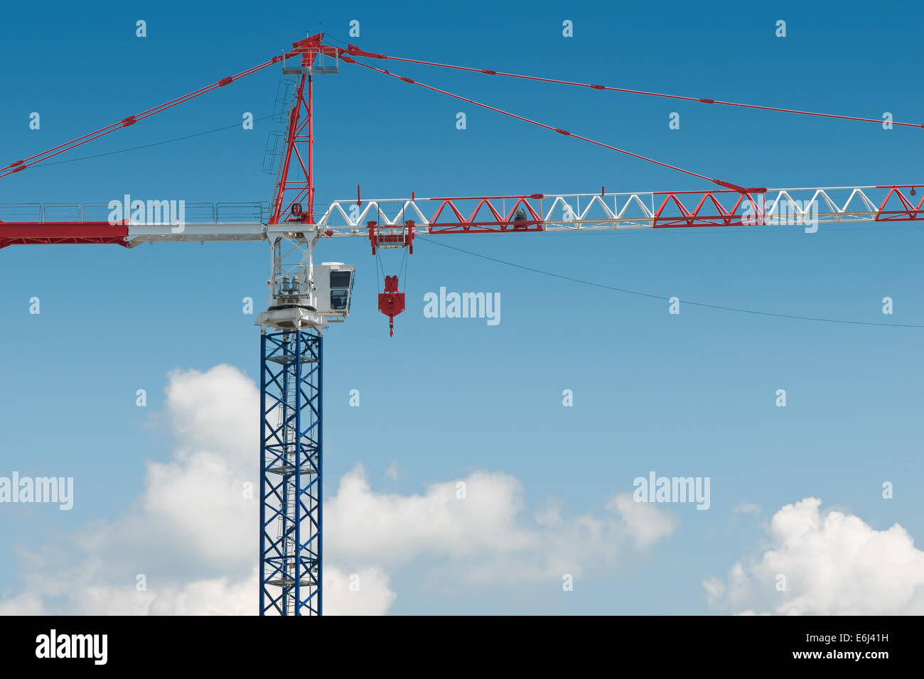 high crane on blue cloudy sky background Stock Photo - Alamy