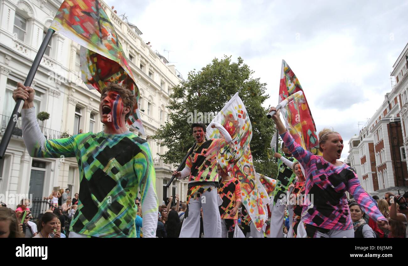 (140825) -- LONDON, Aug. 25, 2014 (Xinhua) -- Performers parade through the streets during the Notting Hill Carnival in London, Britain, on August 24, 2014. The Notting Hill Carnival is the largest street festival in Europe and was first held in 1964 by the Afro-Caribbean community. Over the bank holiday weekend, the streets come alive to bands, colourful floats and costumed performers as members of the public flood into the area to join the celebrations. (Xinhua/Han Yan) Stock Photo