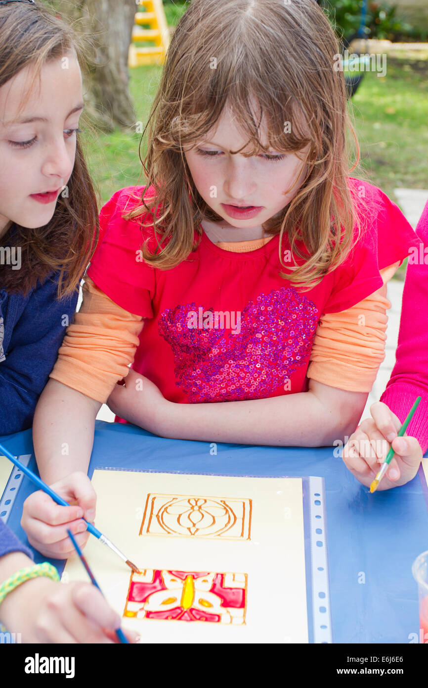 Three girls painting Stock Photo