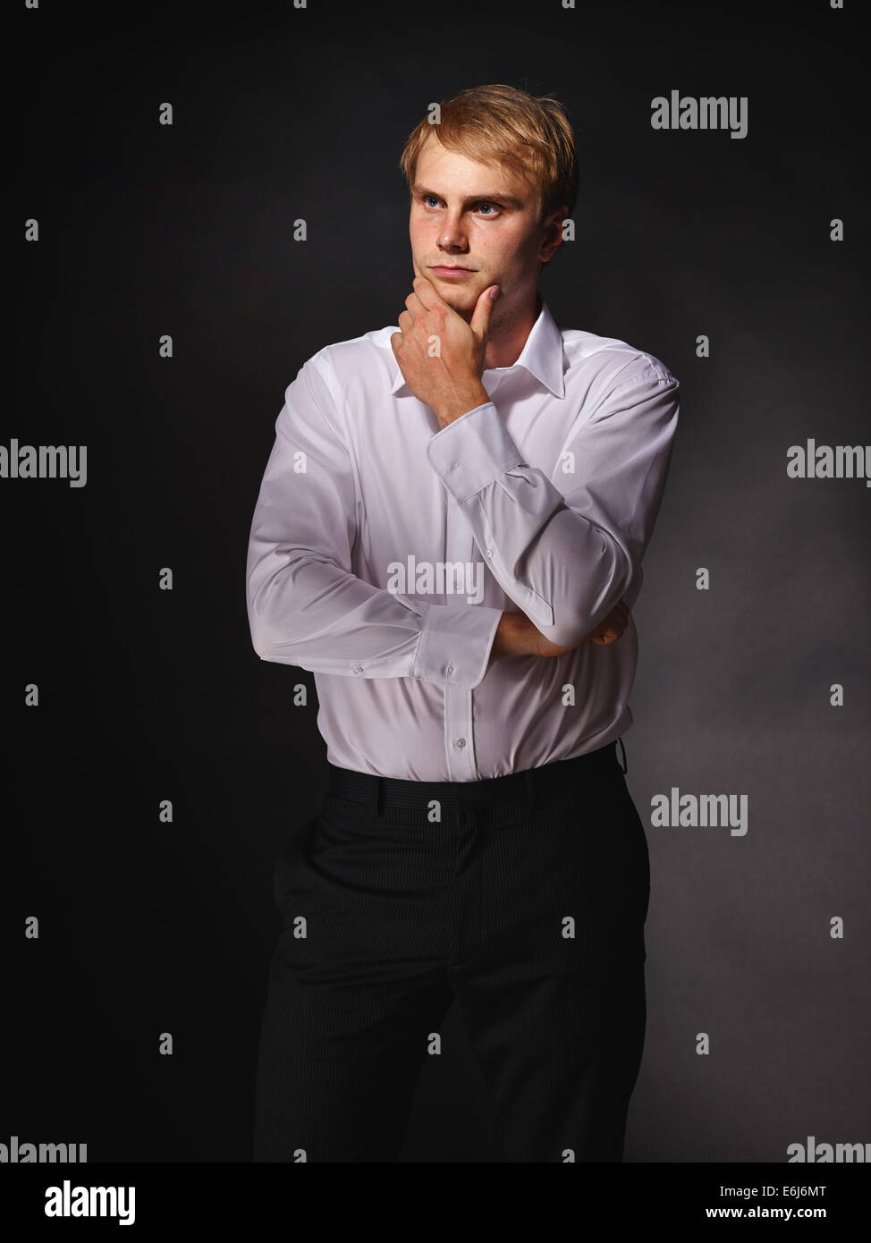 Casual and handsome modern businessman wearing black suit and white