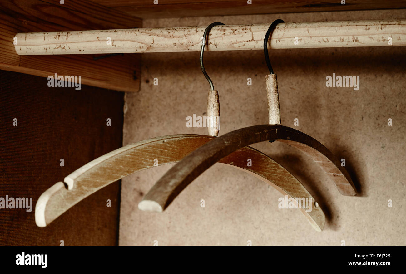 Two old wooden hanger inside the wardrobe Stock Photo
