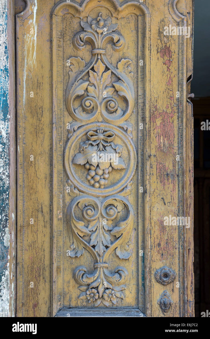 Old wooden ornamented door Stock Photo