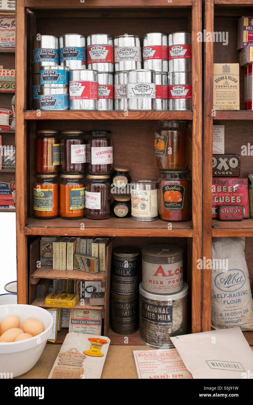 1940s replica grocers shop with packets of food and household items on the shelves at a historical military Reenactment show. UK Stock Photo
