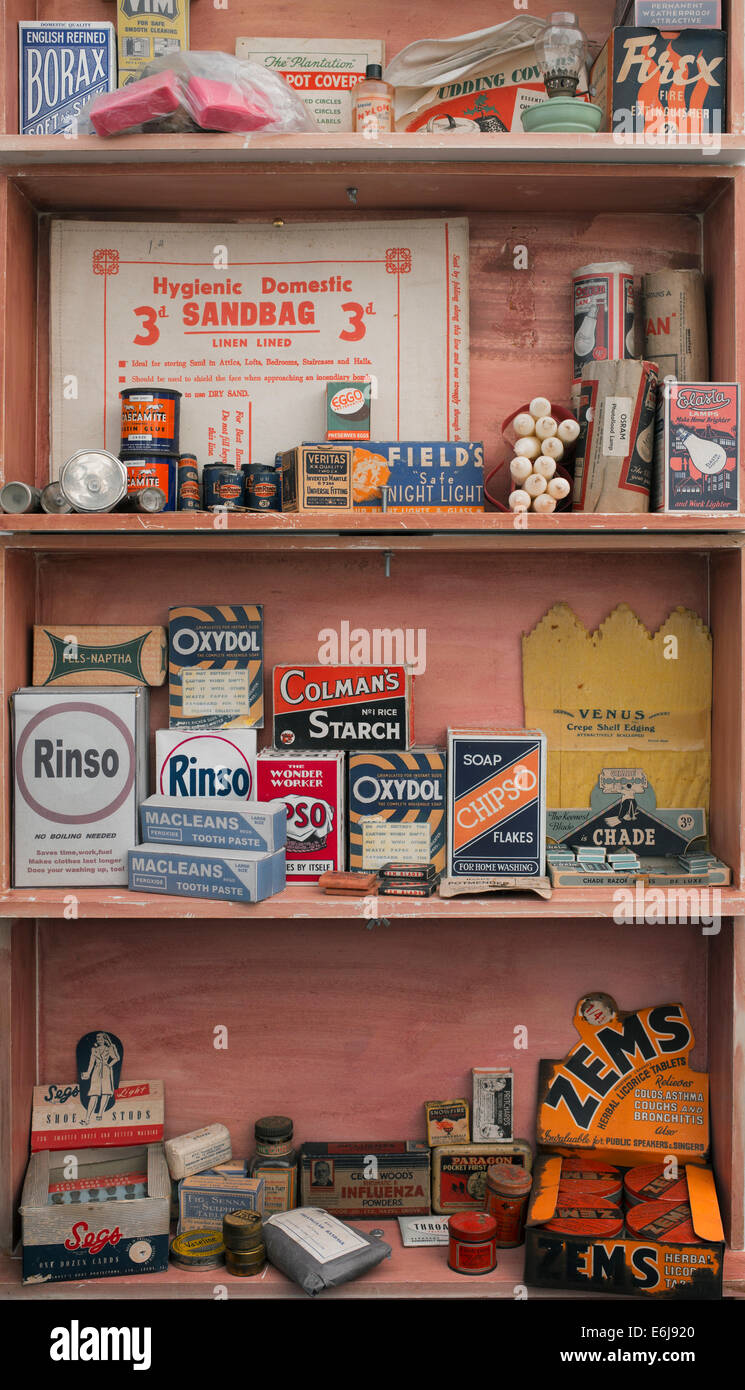 1940s replica grocers shop with packets household items on the shelves at a historical military Reenactment show. UK Stock Photo