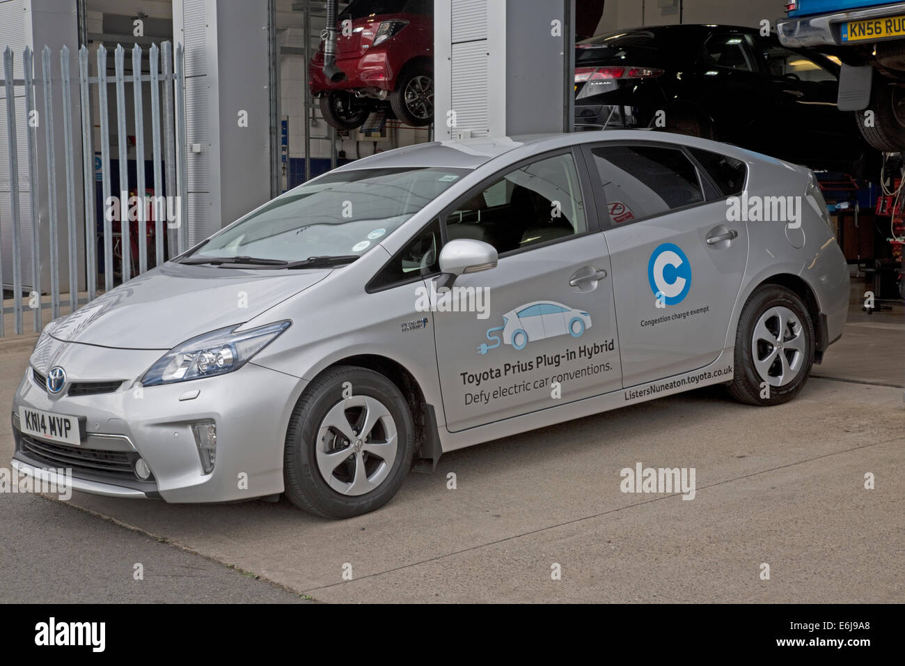Toyota Prius Plug In OLEV ultra low emission mid-size plug-in hybrid electric vehicle parked Stock Photo
