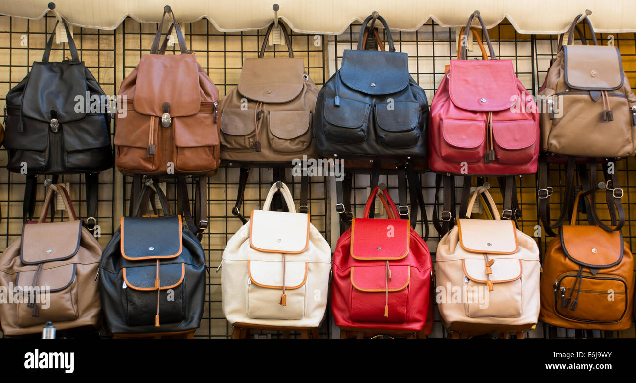 Rows of leather handbags for sale, in a variety of colours. Stock Photo