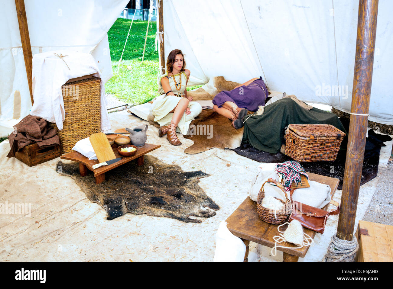 Couple lying in replica of antique Roman tent Stock Photo