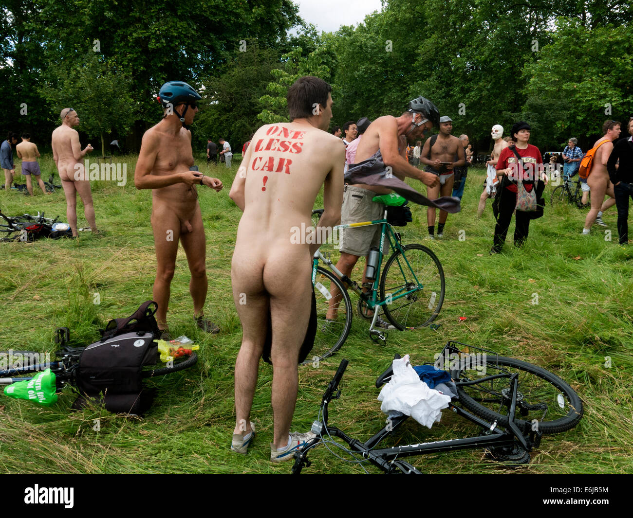 Naturalists in a London Park with Cycles, England, UK, A hedonistic demonstration on World Naked Bike Ride Stock Photo