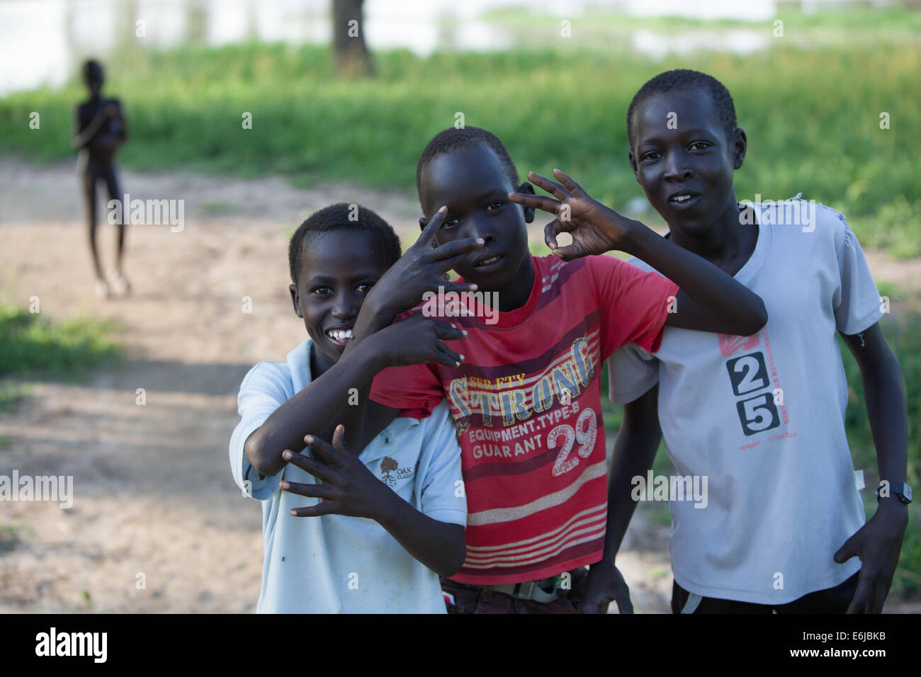 Agok Children throwing shapes by river at Agok, Abyei, Sudan / South Sudan ...