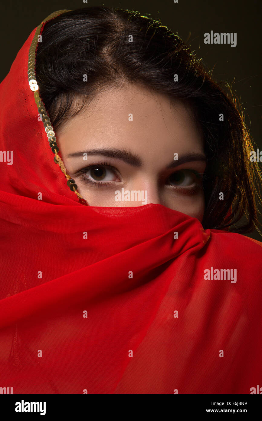 Sad Girl In Red Hijab Looks At Camera Stock Photo Alamy