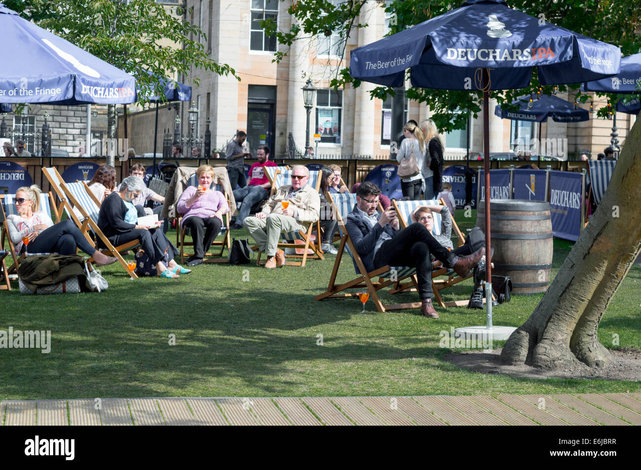 People enjoying an afternoon drink in St Andrew Square, Edinburgh Stock Photo