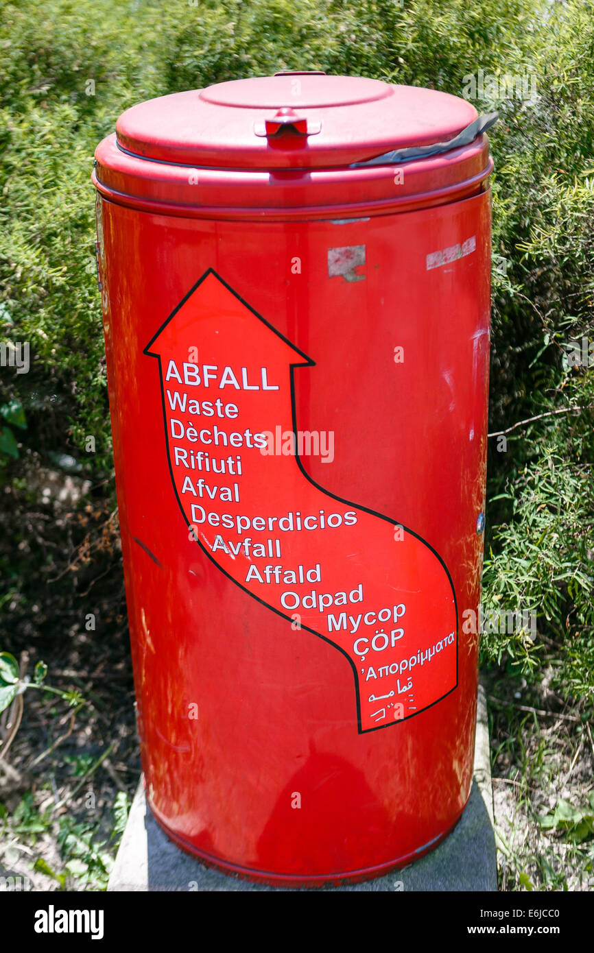 Red garbage can with international labeling Stock Photo Alamy