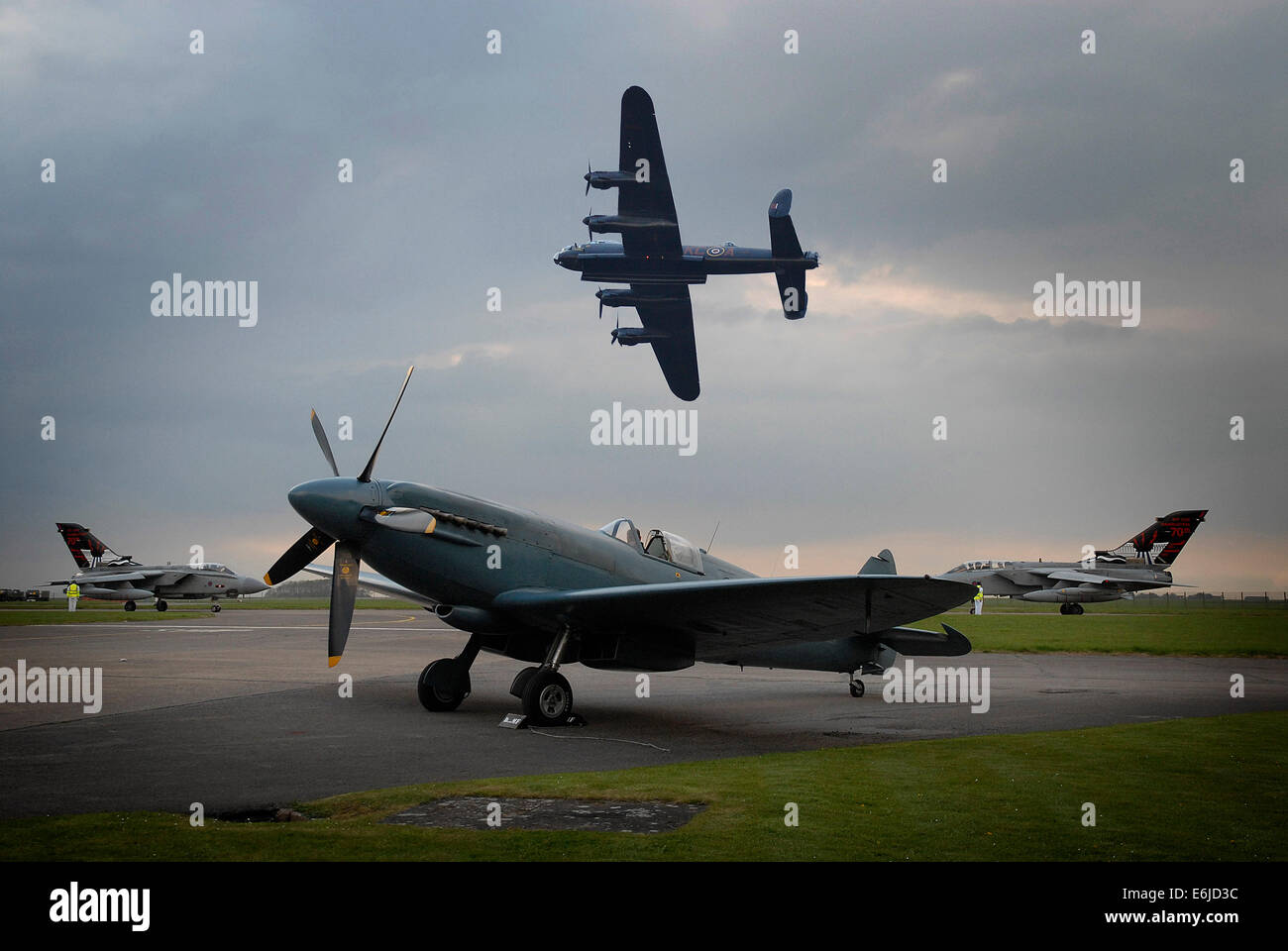 Tornado, Spitfire and Lancaster Bomber aircraft at RAF Scampton, Lincs., for the sunset memorial service, 16-May-2013. Stock Photo