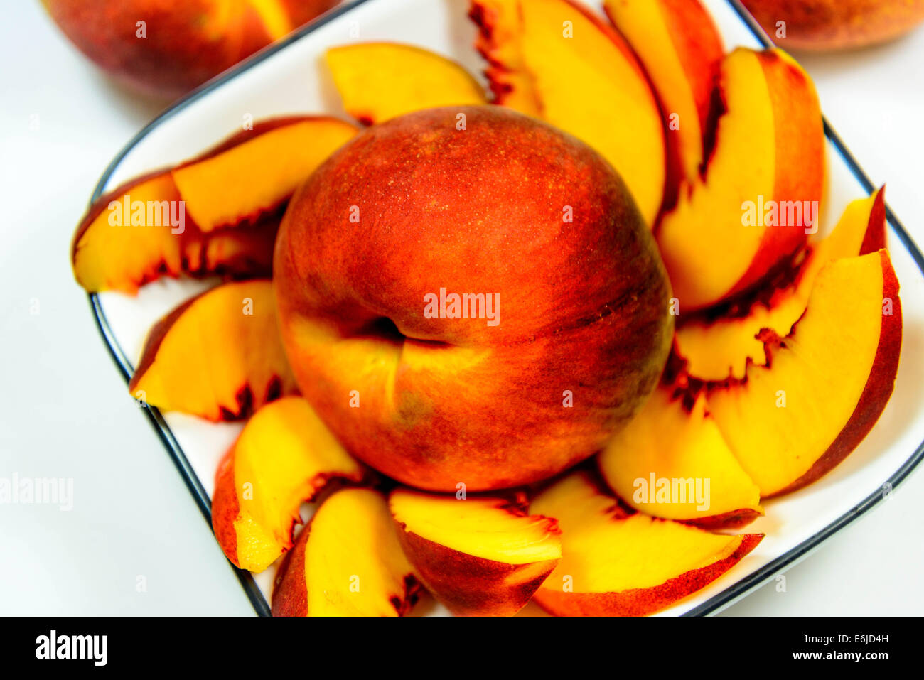 sliced fresh ripe peaches ready to eat Stock Photo - Alamy