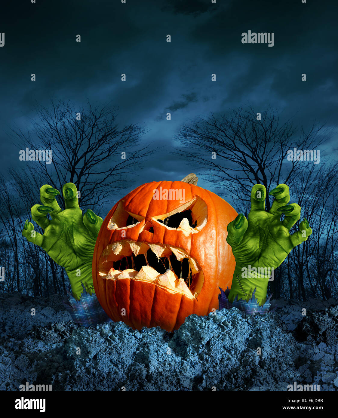 Zombie pumpkin halloween greeting card with copyspace as a scary surprise  creepy jack o lantern with monster green hands rising Stock Photo - Alamy
