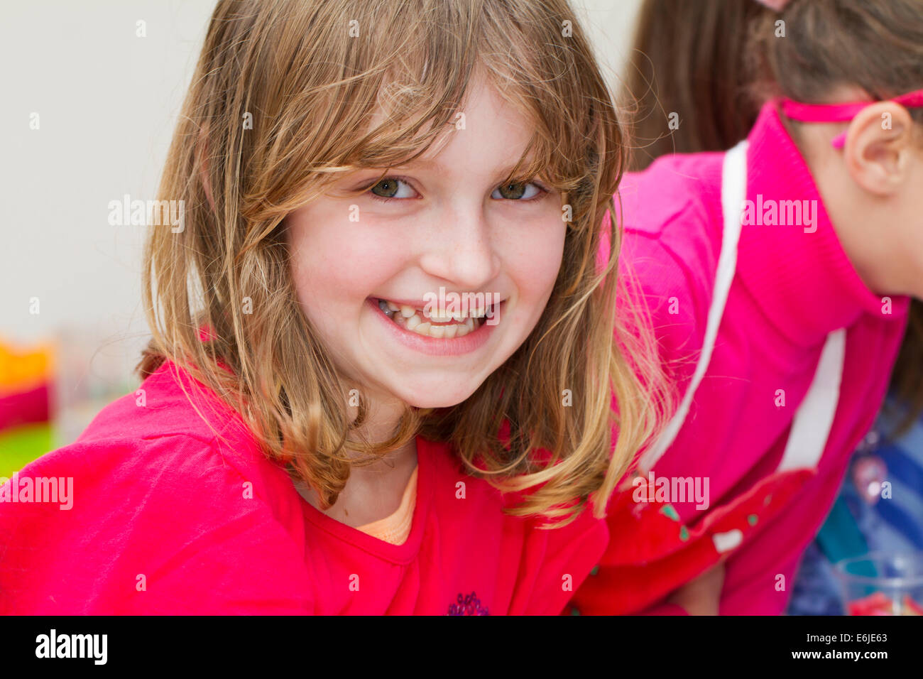 Nine year old girl smiling Stock Photo