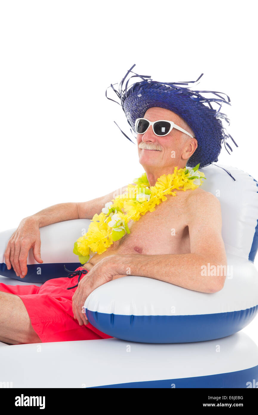 Senior man relaxing in floating chair Stock Photo