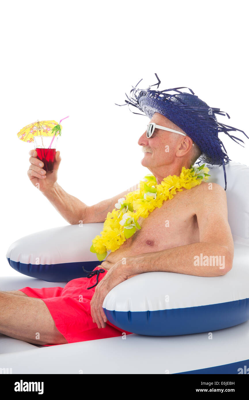 Senior man relaxing in floating chair Stock Photo