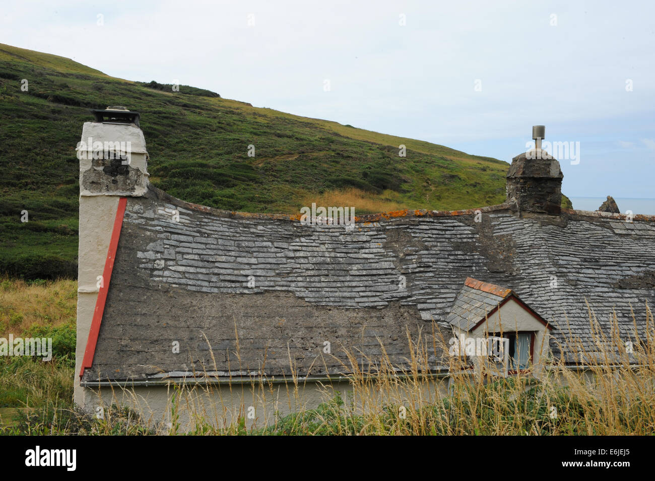 Crooked Slate Roof of Blackpool Mill on the Beach by Hartland Abbey on the North Devon Coast, England, UK Stock Photo
