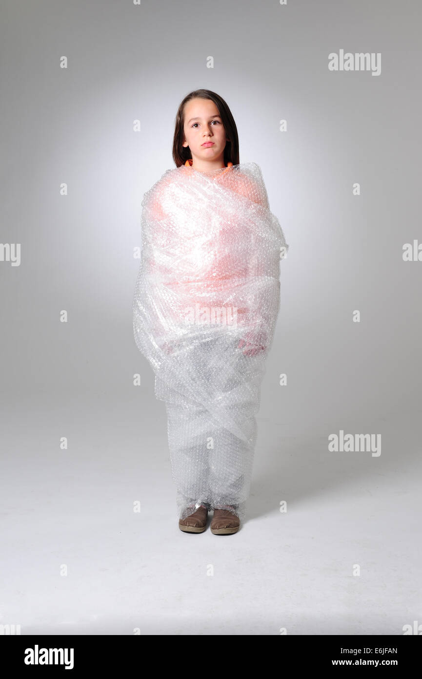 EDITORIAL ONLY Over protection parenting helicopter parents kid wrapped in bubble wrap to