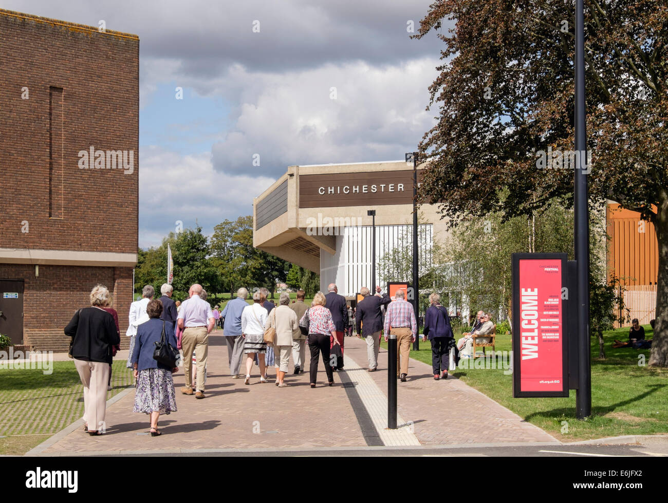 Chichester Festival Theatre with people arriving for a matinee performance in Oaklands Park. Chichester West Sussex England UK Stock Photo