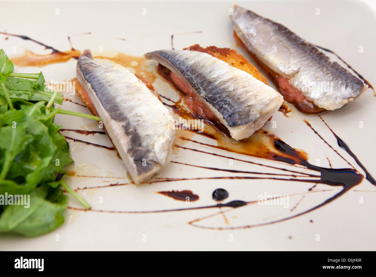 Sardines on toast appetizer at restaurant in Lisbon, Portugal Stock