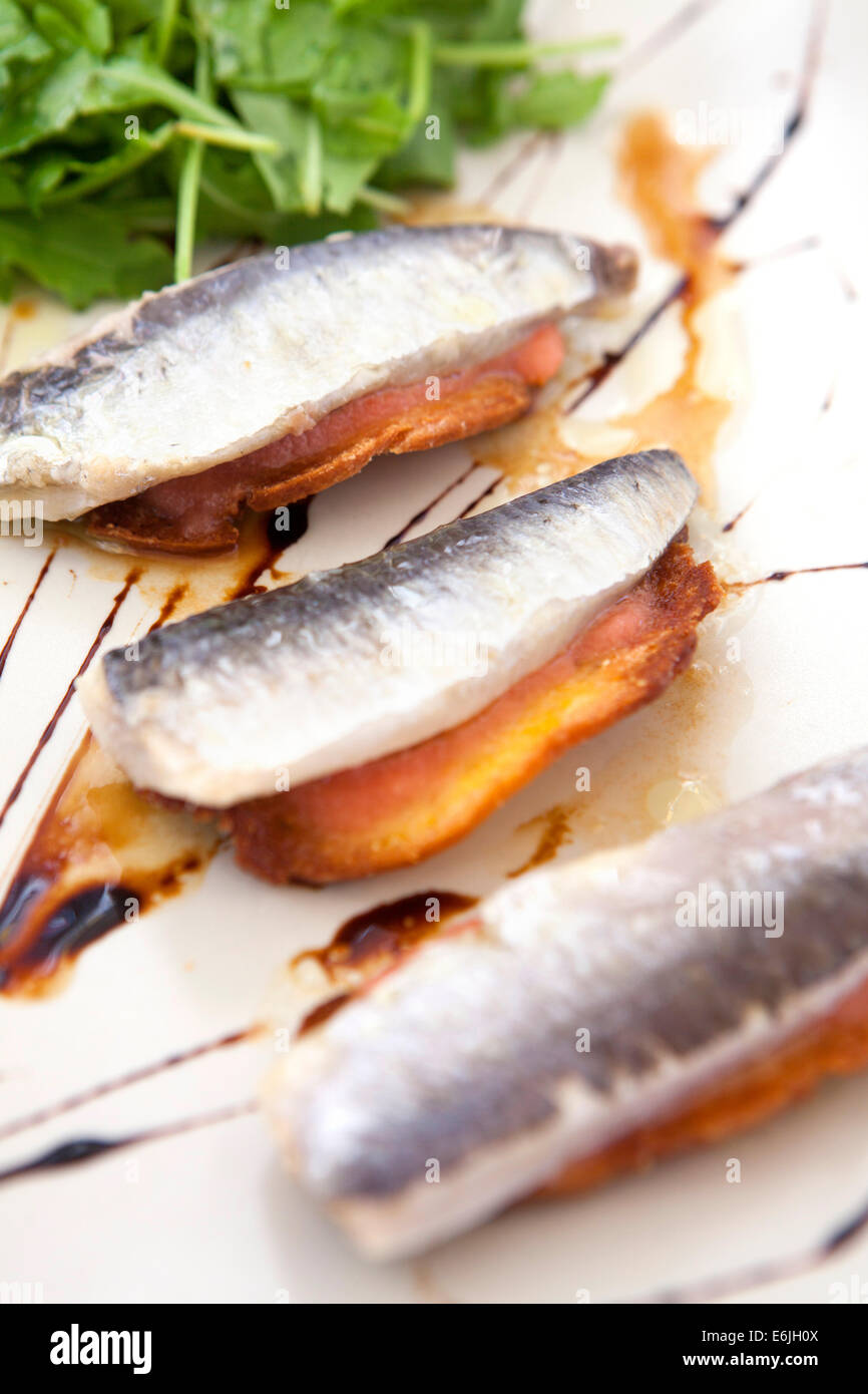 Sardines on toast appetizer at restaurant in Lisbon, Portugal Stock