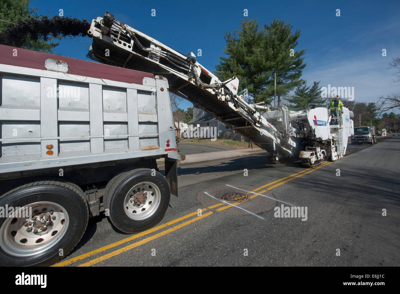 Pavement milling, cold planing, asphalt milling, or profiling machine prepared road in Hartford for repaving Stock Photo