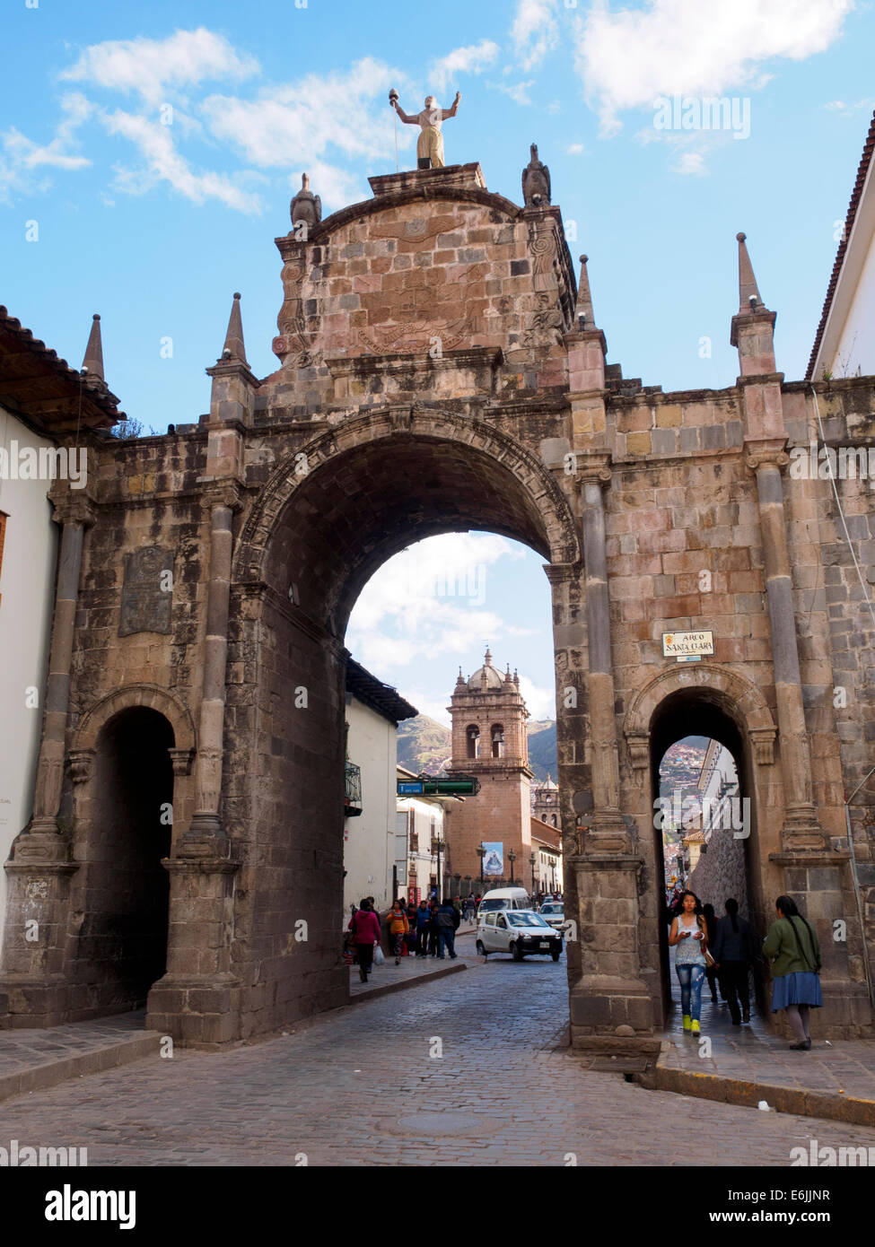 Santa Clara arch and church of San Pedro bell tower - Cusco, Peru Stock Photo