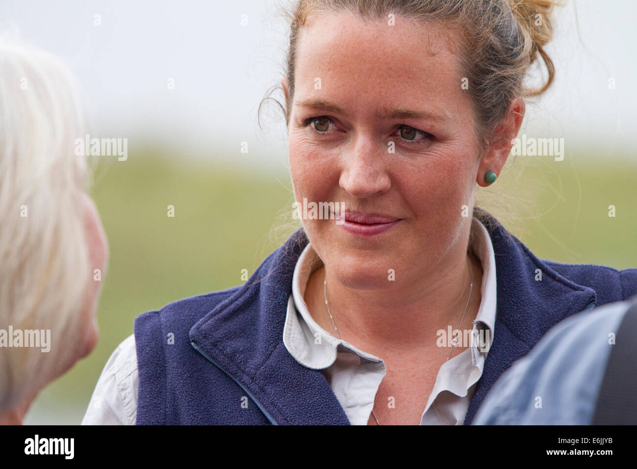 Portrait of a young lady listening to another lady Stock Photo