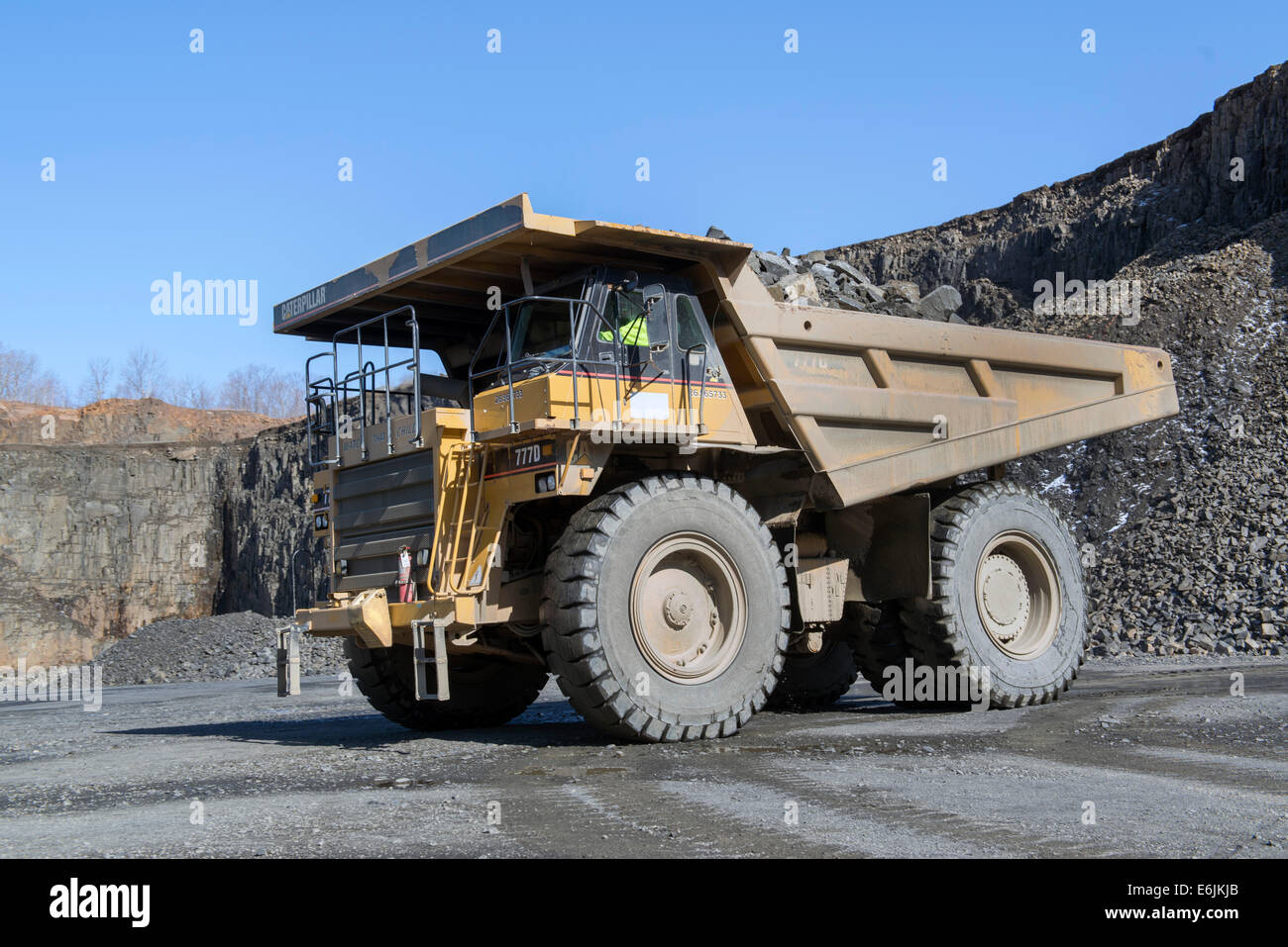 Branford, CT.  100 ton Caterpillar 7770D truck hauling basalt trap rock mined from basalt ridge at the Tilcon plant. Stock Photo