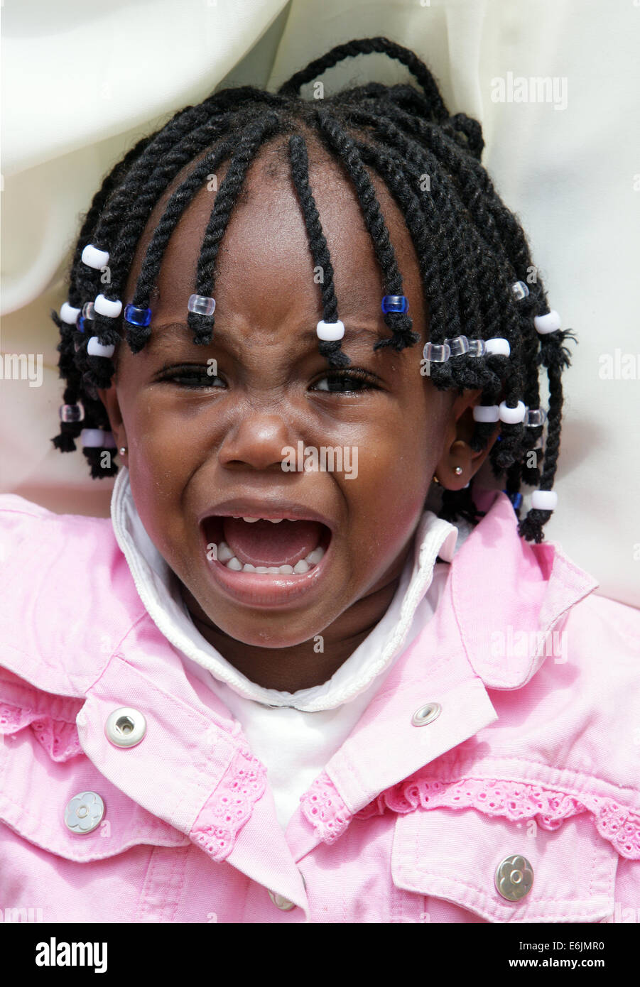 African girl (20 month old) with dread locks crying. Nairobi, Kenia Stock Photo