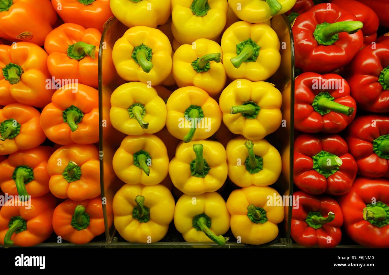 Healthy produce on shelves at a market - bell peppers Stock Photo