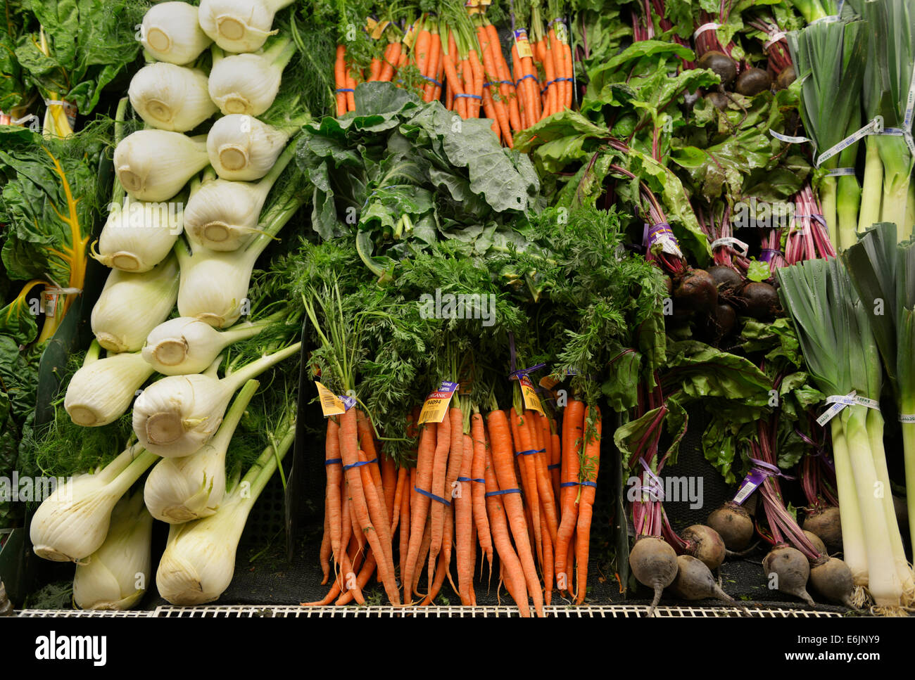 Healthy produce on shelves at a market Stock Photo