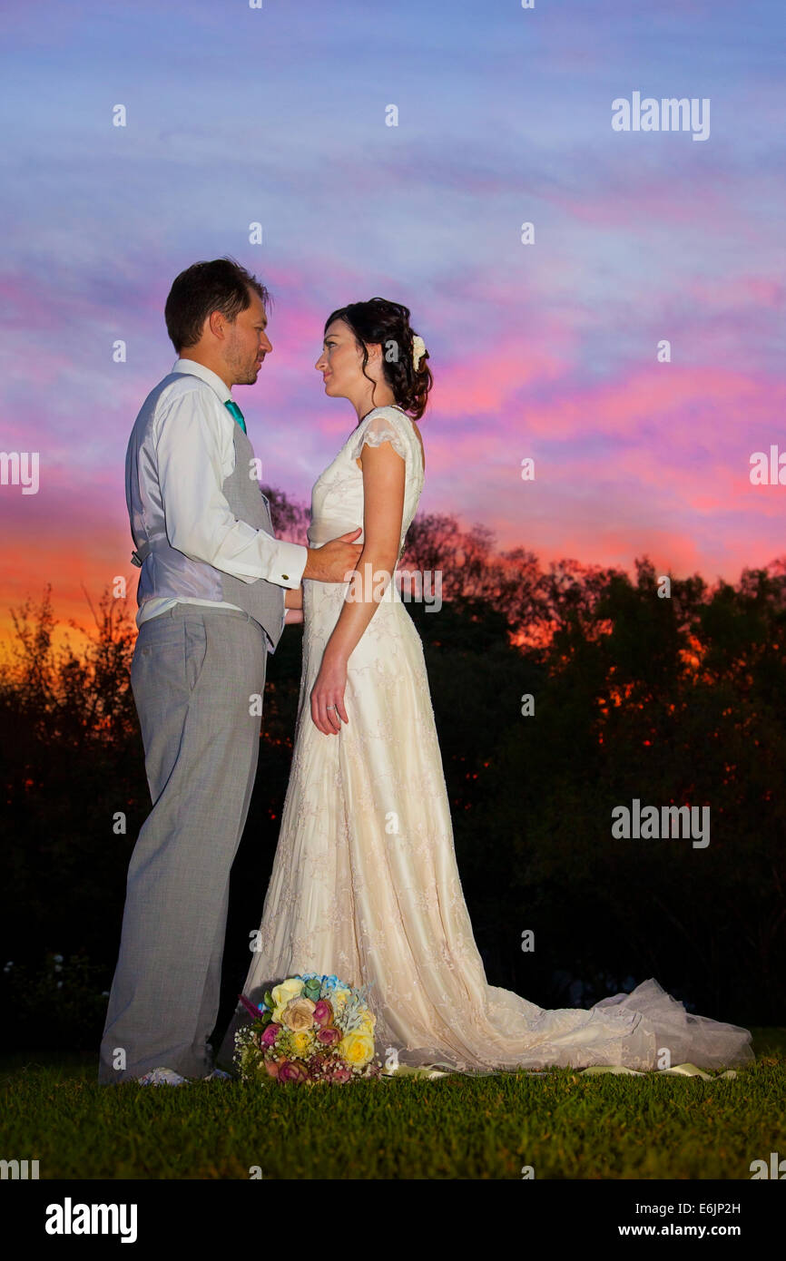 Newlyweds under a beautiful sky at sunset, South Africa Stock Photo