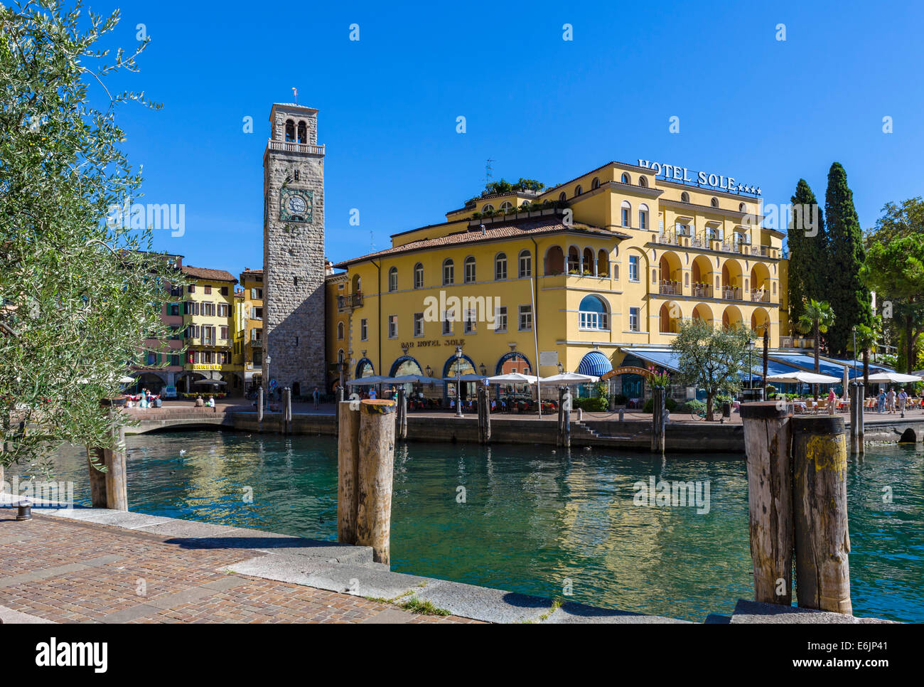The Hotel Sole and Torre Apponale by the harbour in Riva del Garda, Lake Garda, Trentino-Alto Adige, Italy Stock Photo
