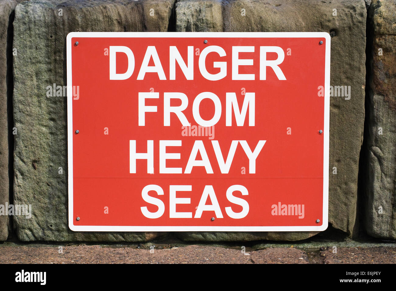 Danger from Heavy Seas sign. Stock Photo