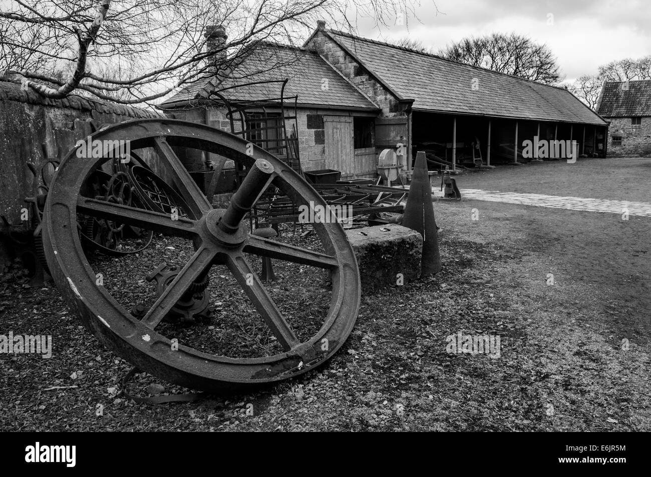 Historic farm machinery monotone in museum Stock Photo
