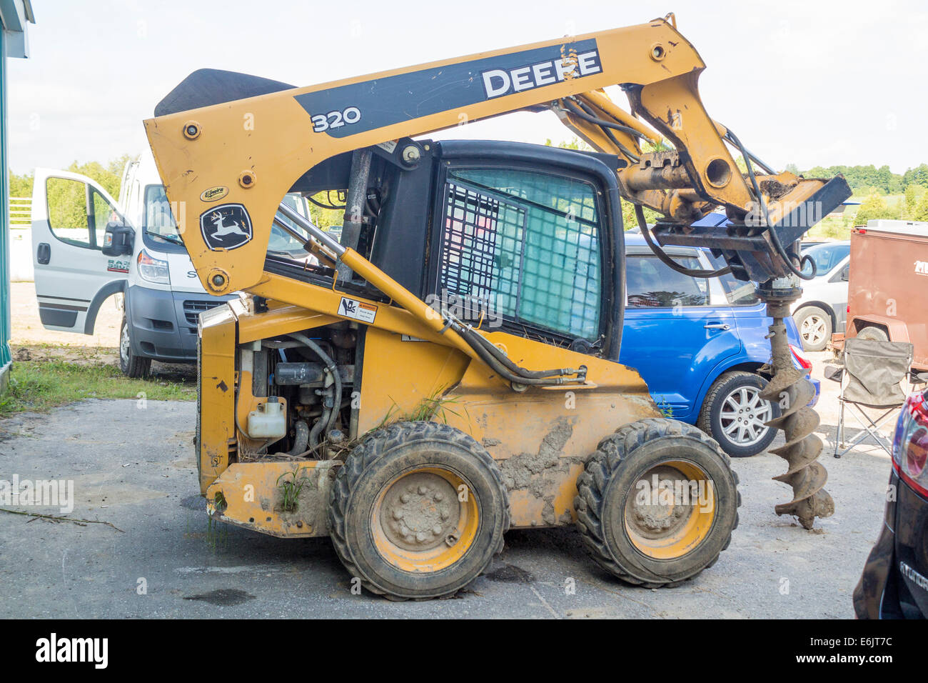 Johm Deere skid steer with attached auger Stock Photo Alamy