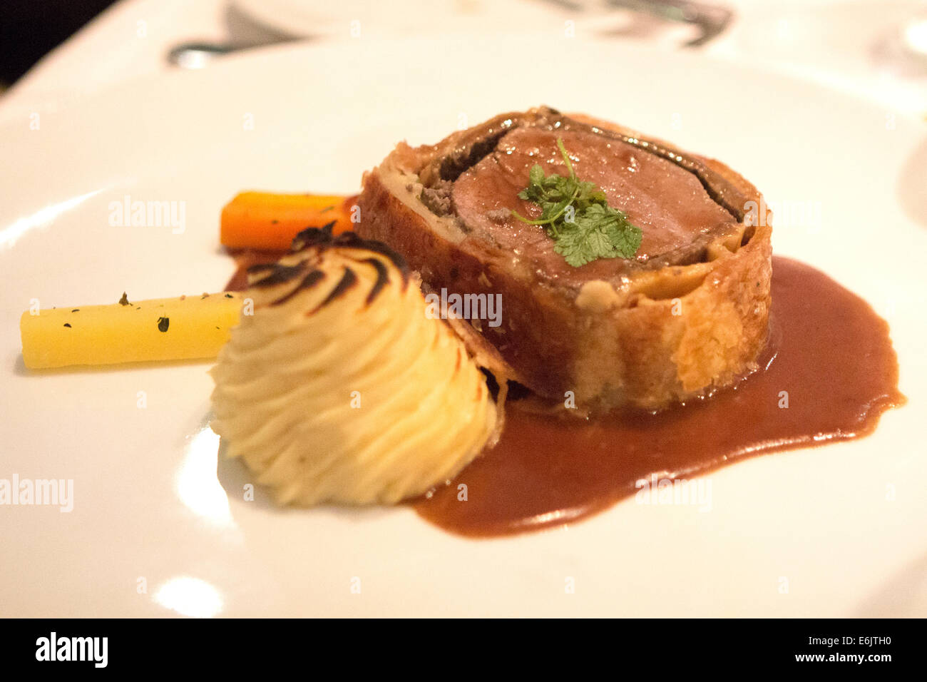 Beef wellington with mashed potatoes carrots and gravy Stock Photo Alamy