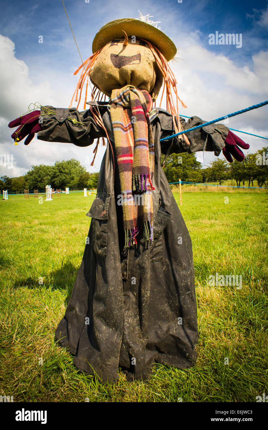 Full length portrait view of a scarecrow in a field on a sunny day Stock Photo