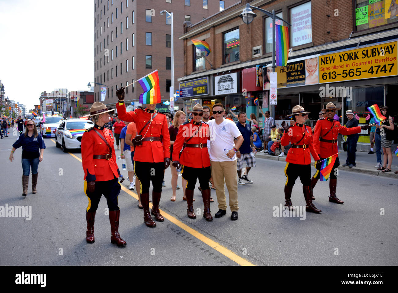 Ottawa, Canada - August 24, 2014:  Members of the Royal Canadian Mounted Police partake in annual Gay Pride Parade on Bank St Stock Photo