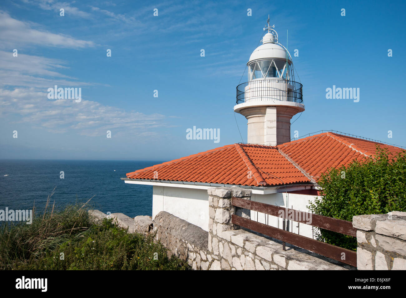 Lighthouse overlooking the sea Stock Photo