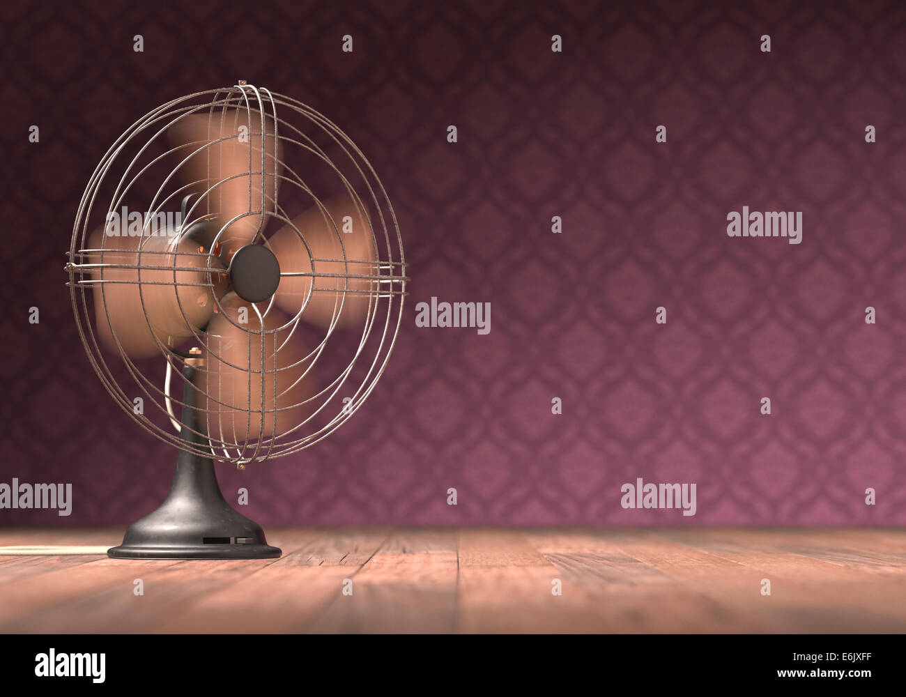 Old antique fan on a wooden floor with retro background. Stock Photo