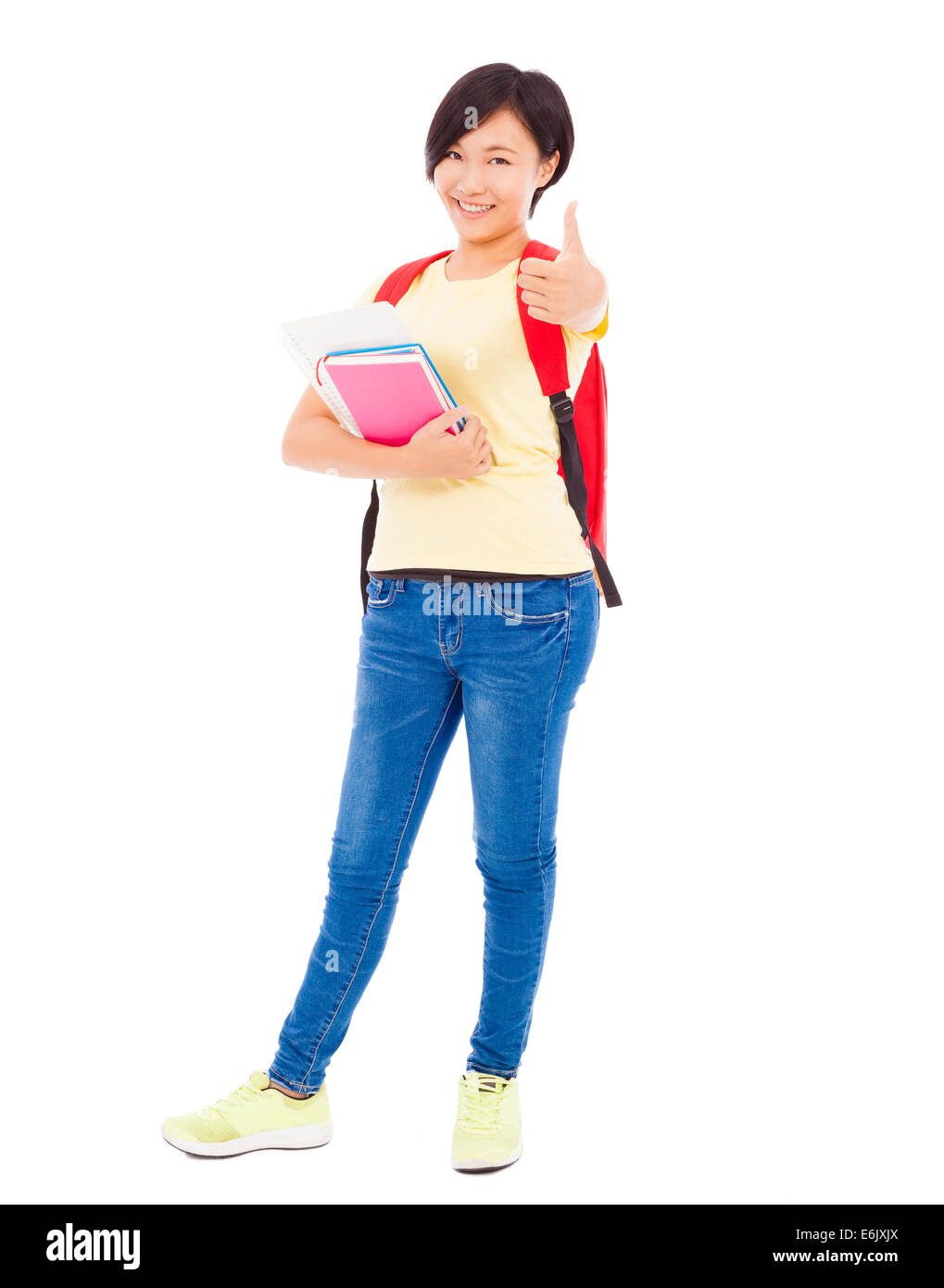 full length of  student girl standing and thumb up over white background Stock Photo