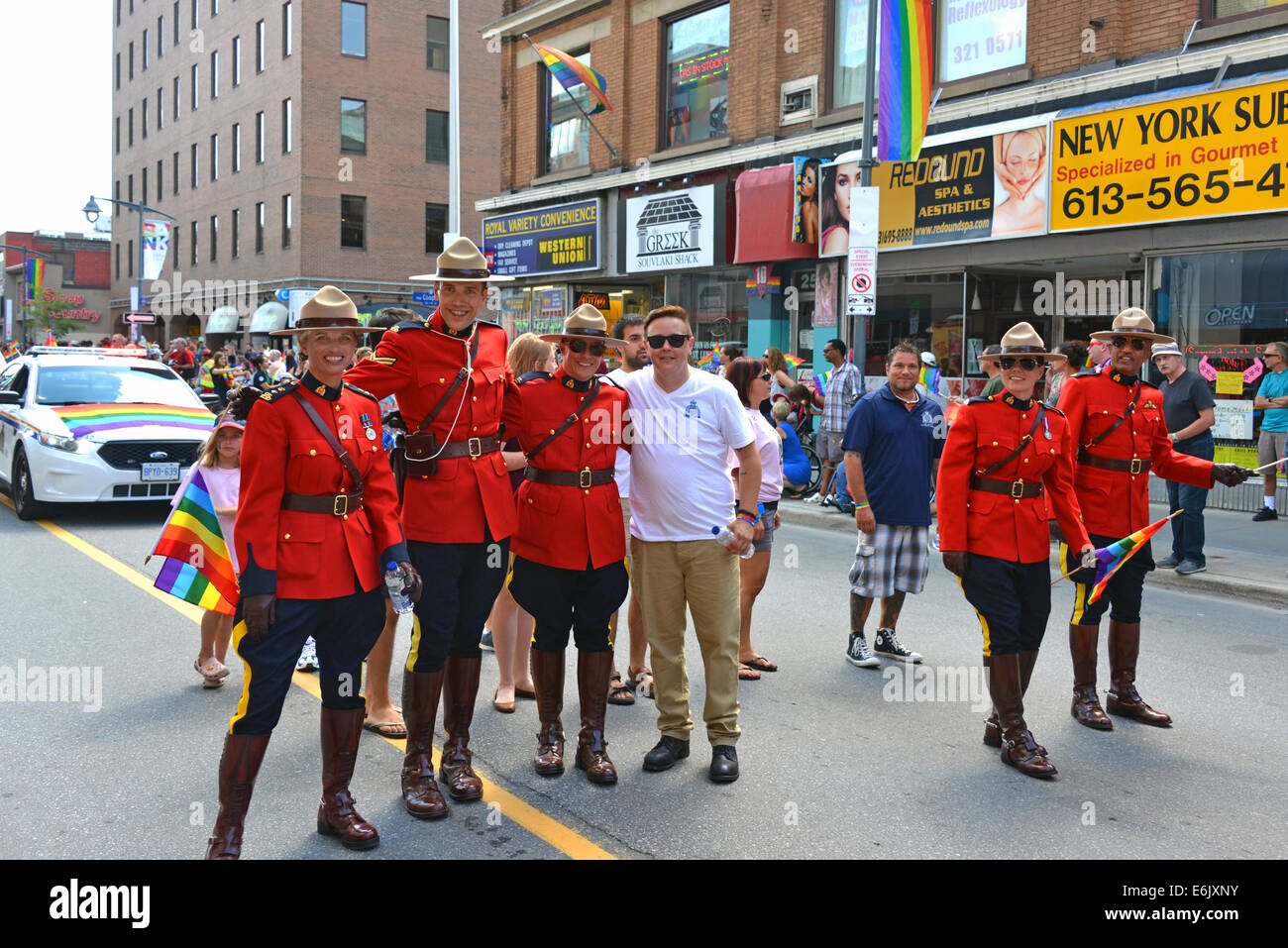 Ottawa, Canada - August 24, 2014:  Members of the Royal Canadian Mounted Police partake in annual Gay Pride Parade on Bank St Stock Photo