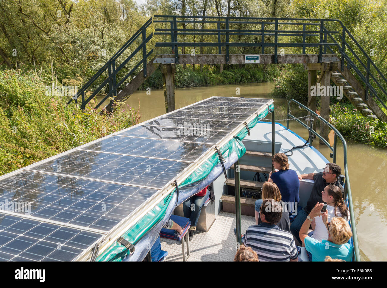 Solar powered boat with visitors in Biesbosch National Park freshwater tidal wetland in the Netherlands. Stock Photo